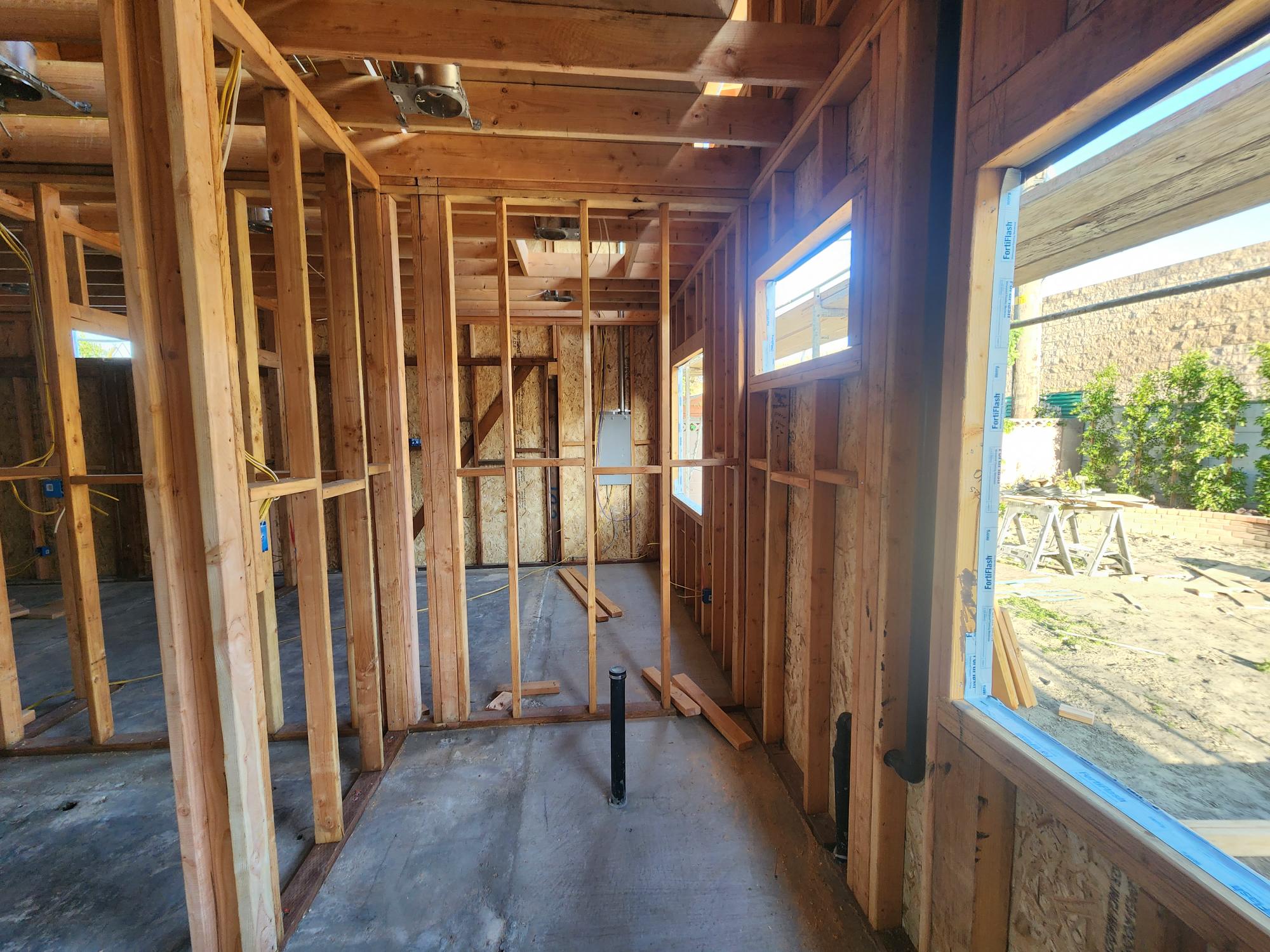 Interior wall framing beside windows