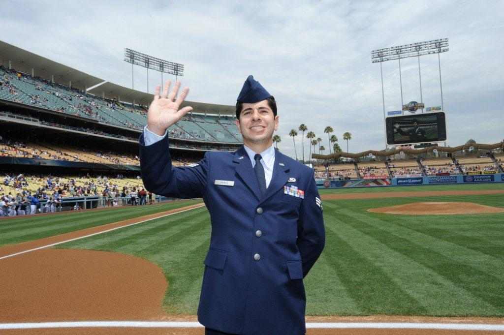 Person in military uniform waving