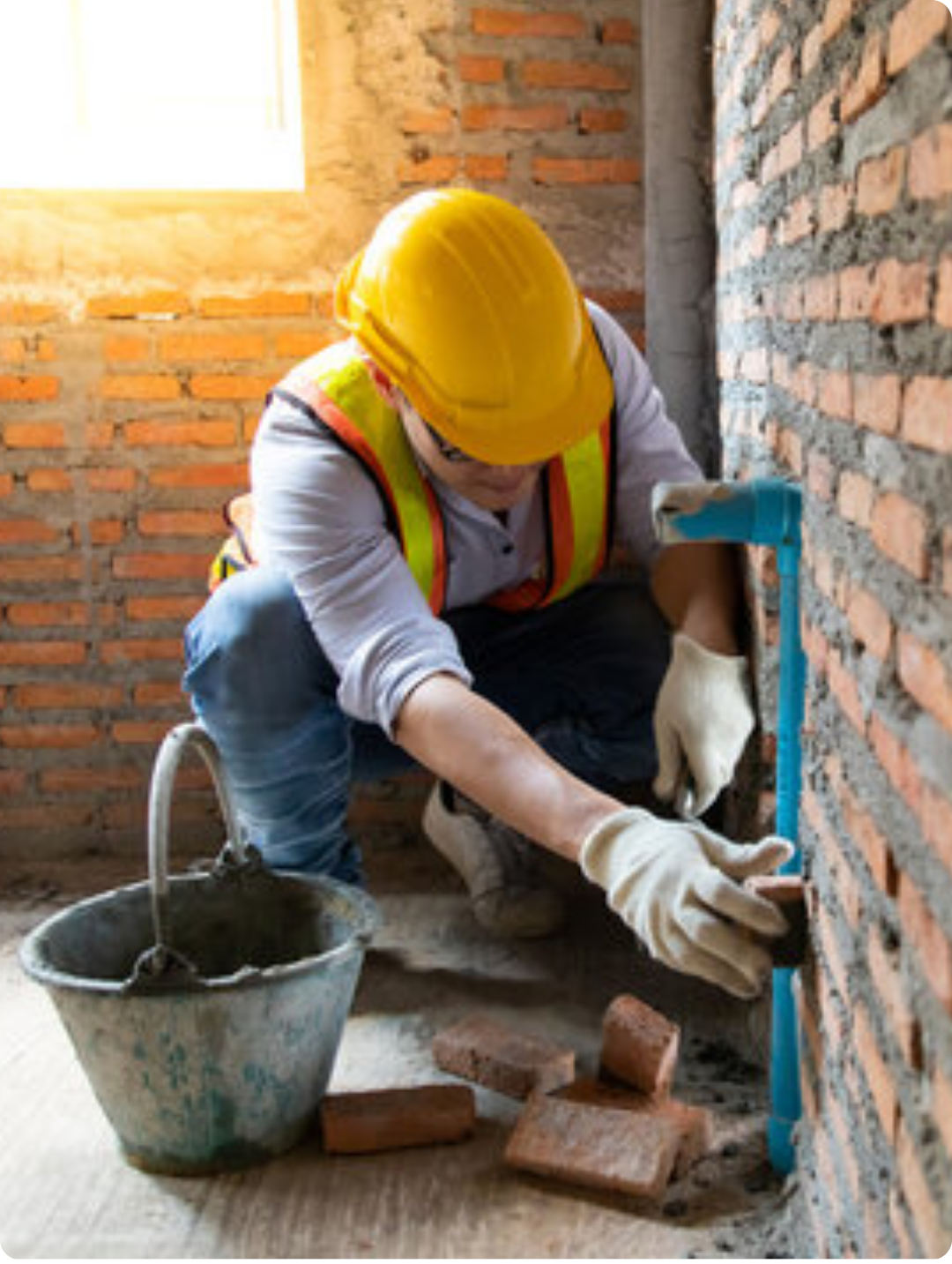 Bricklayer building a wall