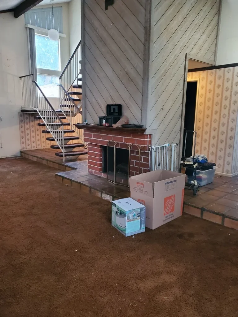 Living room with stairs and fireplace
