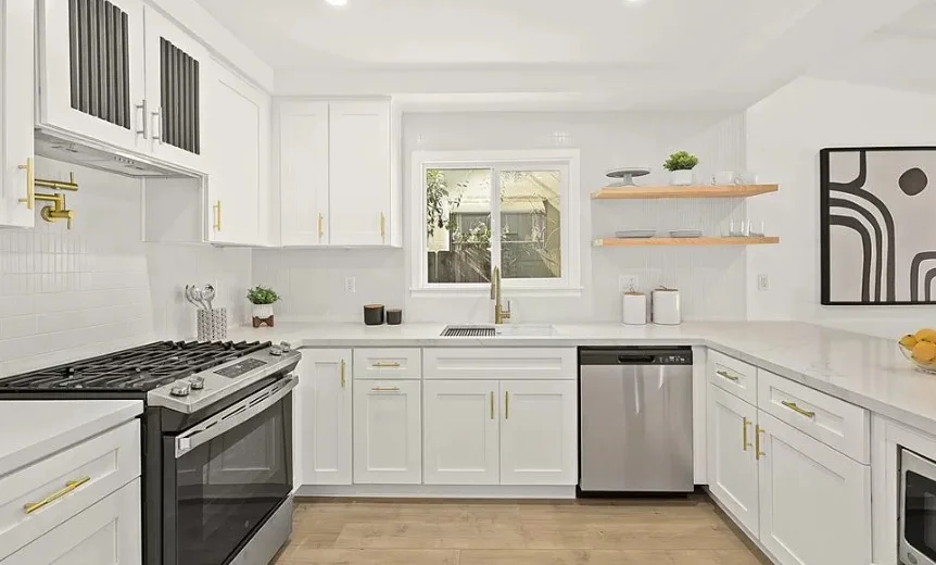 White kitchen with stainless steel appliances