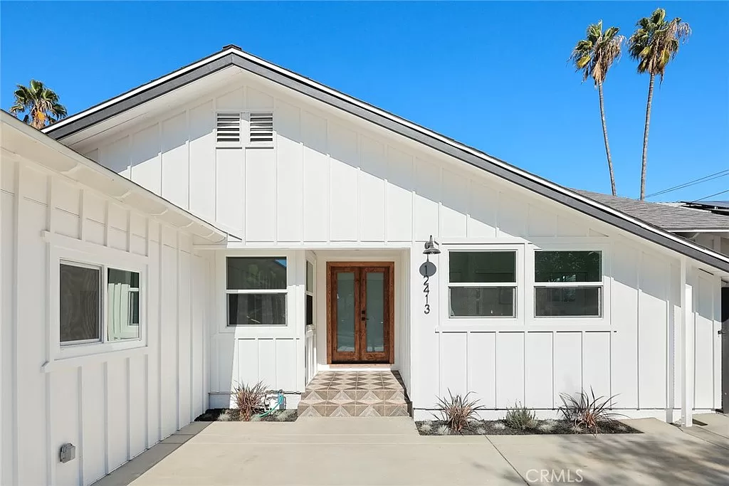 White house with wooden front door