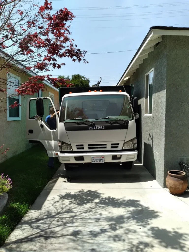 Truck parked beside a house