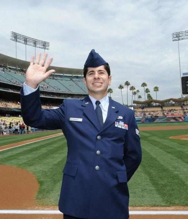 Person in military uniform waving