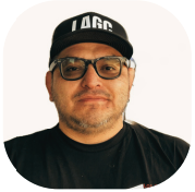 Man wearing glasses and a cap